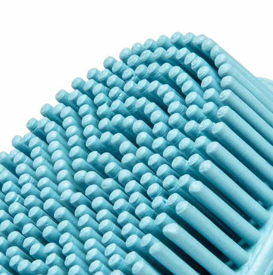 Close-up of a blue cleansing brush