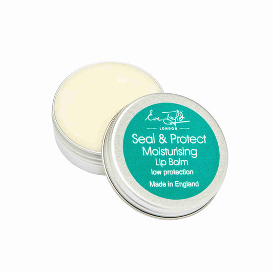 Lip balm with green lid and white container on a white background