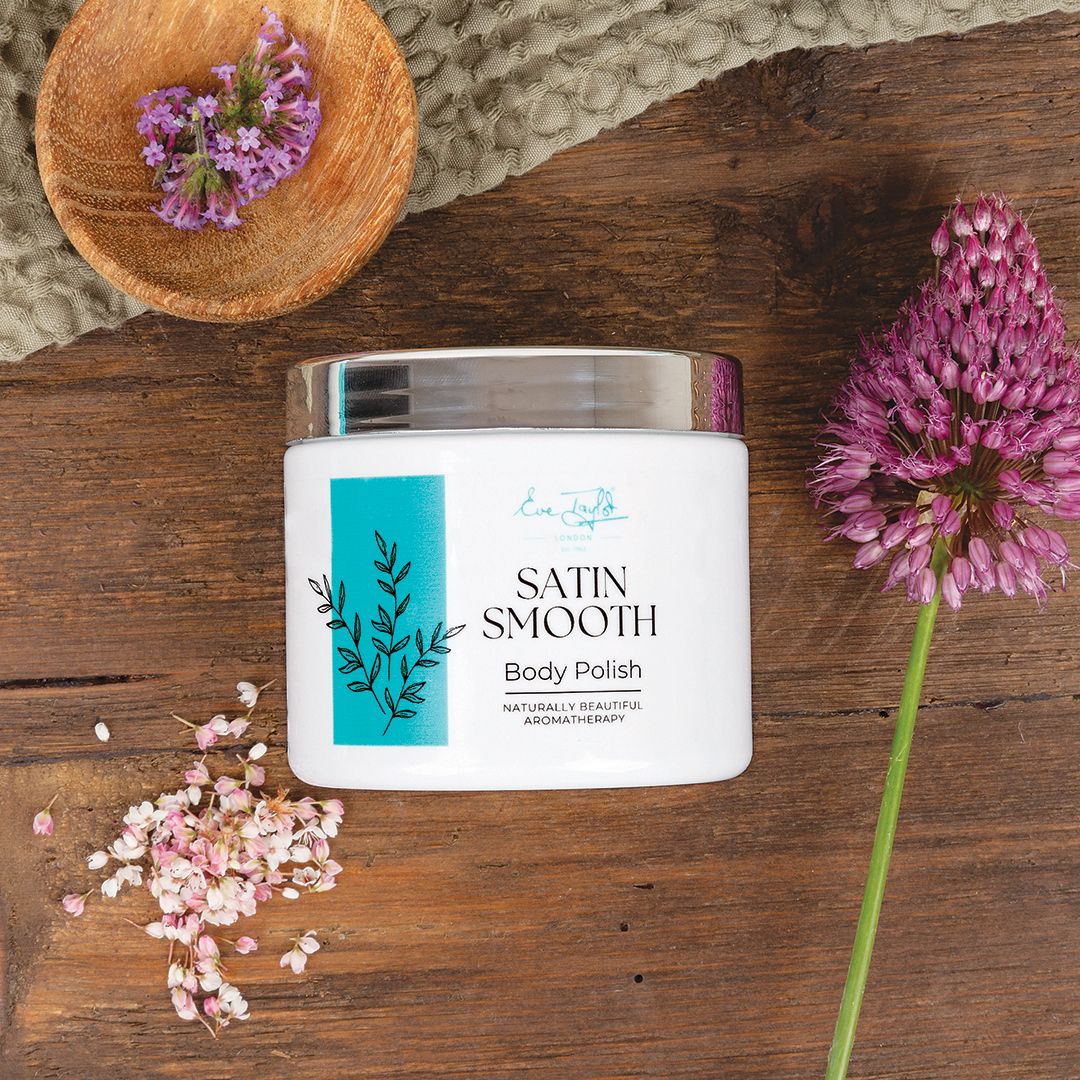 Eve Taylor London body polish jar, white with teal botanical panel and metallic lid.