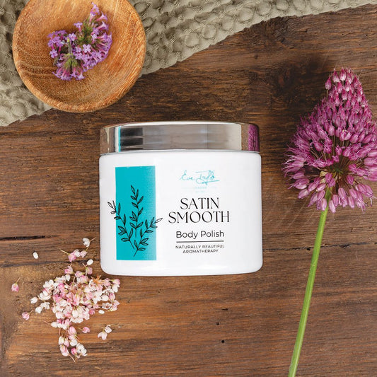 Eve Taylor London body polish jar, white with teal botanical panel and metallic lid.