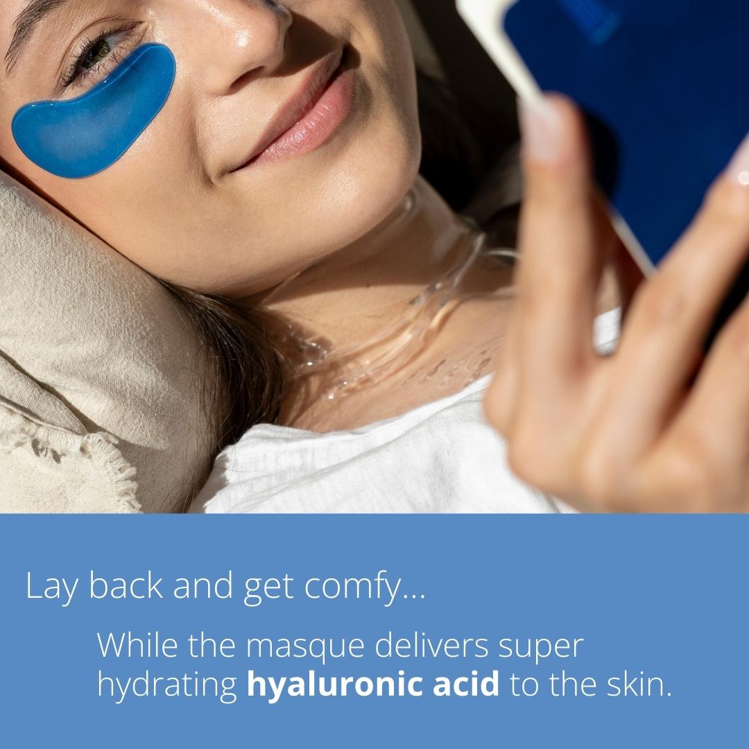 Blue facial mask patch on cheek with applicator holding over skin