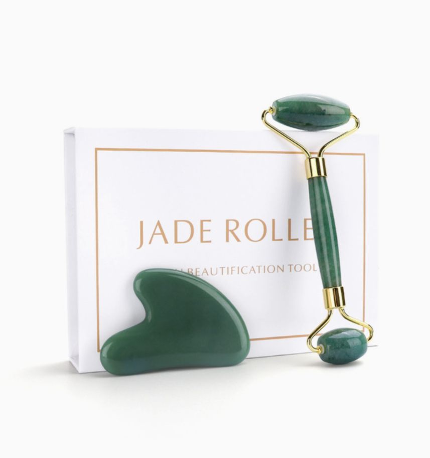Green jade face roller and heart gua sha with gold-toned handles