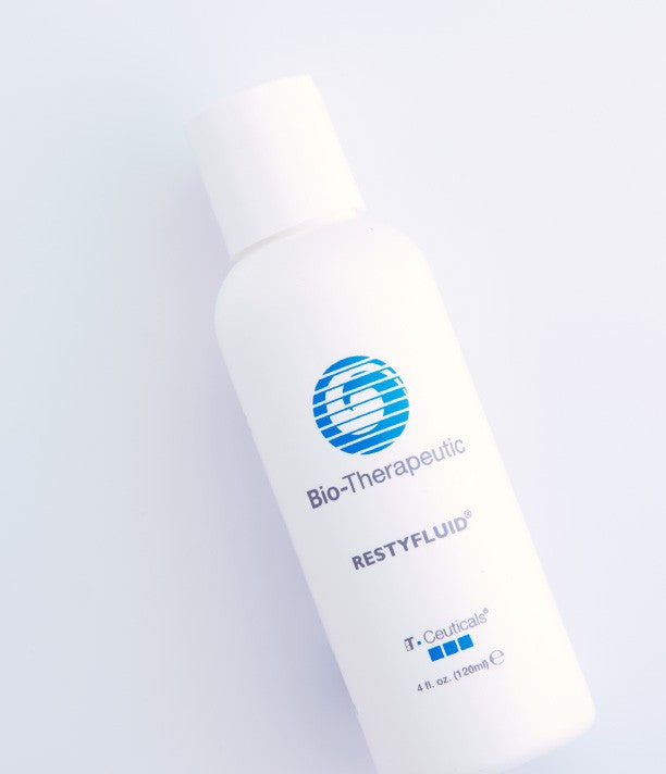 Bio-Therapeutic RestyFluid bottle on a light gray background