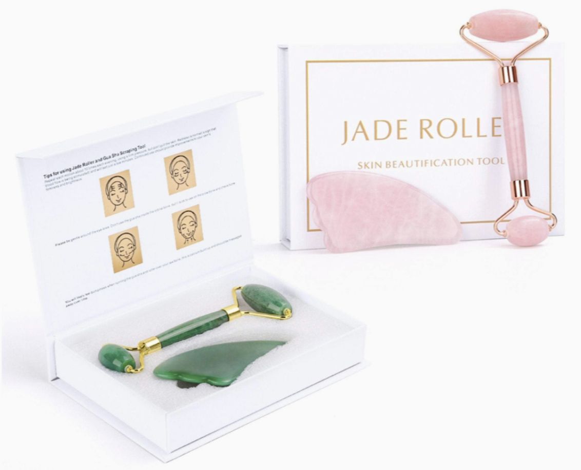 Pink jade roller and heart gua sha tools in a gift box display