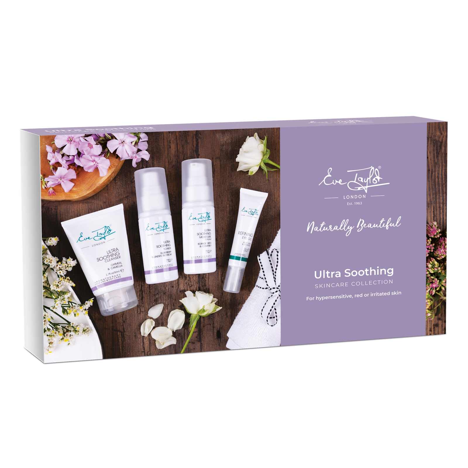 Eve Taylor London skincare collection packaging with products and flowers on a wooden surface.