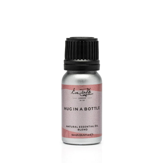 Essential oil diffuser blend bottle with black ribbed cap and pink label