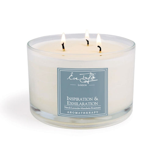 Three-wick aroma wax candle in clear jar with blue label