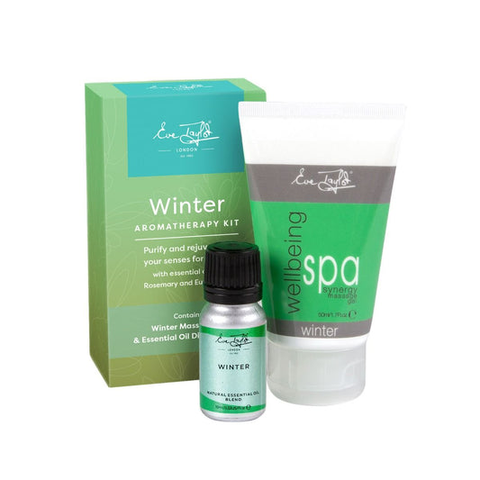 Winter aromatherapy kit with green box, essential oil bottle, and spa gel tube